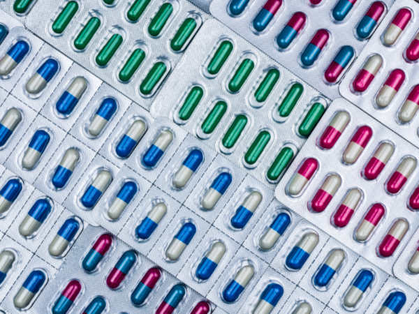 Close-up of different types of medicine capsules packaged in plastic blisters